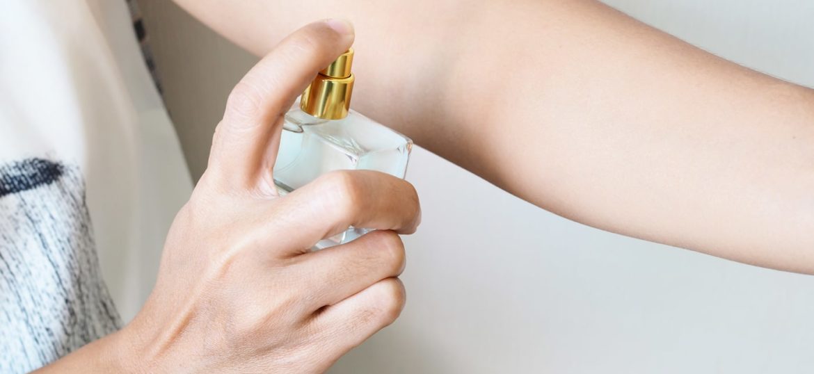 close-up-woman-spraying-perfume-arms-add-fragrance-body close-up-woman-spraying-perfume-arms-add-fragrance-body